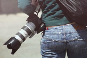 person-woman-camera-photographer-min