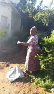 Esther Tembo Mwase complaining on three year failure by Lusaka Water and Sewerage Company to unblock a clogged manhole in Chilenje Township near Chilenje Police Station in Zambia's Capital City -Lusaka on Monday 6th April 2026. - Picture by Ashton Kelly Bunda/ Kwilanzi Newspaper Zambia (KNZ)